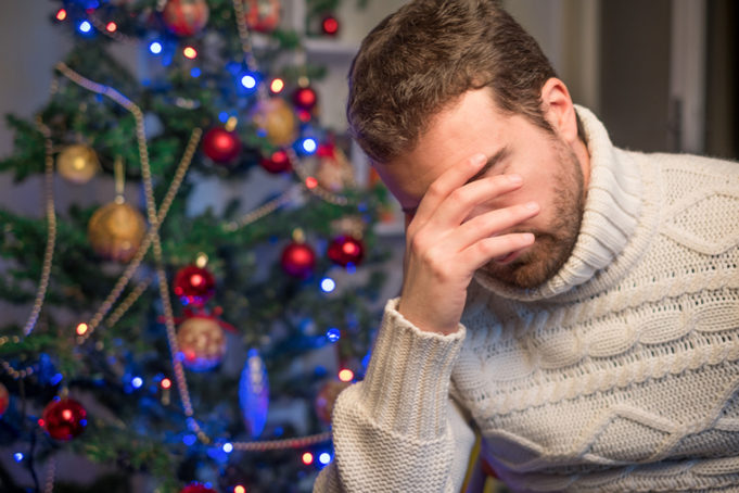 Man felling depressed and lonely during the christmas time - Jude Samson addresses the stress of the holidays and offers various resources for those who may be having a hard time during the season.