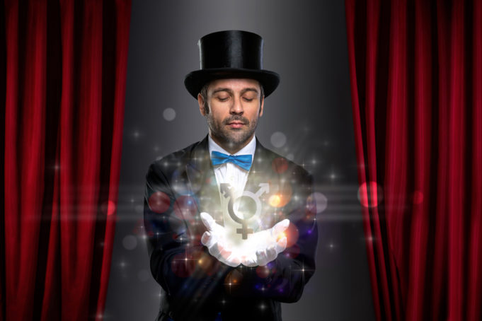 magician holding magic on palm of his hand floating a transgender symbol - Bailey C. on the frustrations of having to constantly remind the world that there is more to us than our gender.